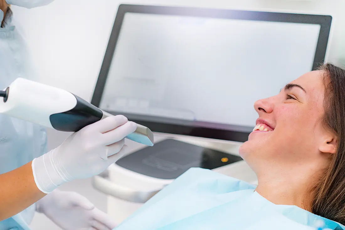 A patient being scanned with the iTero Lumina intraoral scanner at Pak Dental